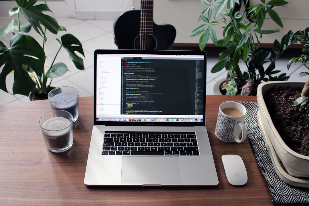 MacBook Pro Desktop Scene with Plants & Guitar